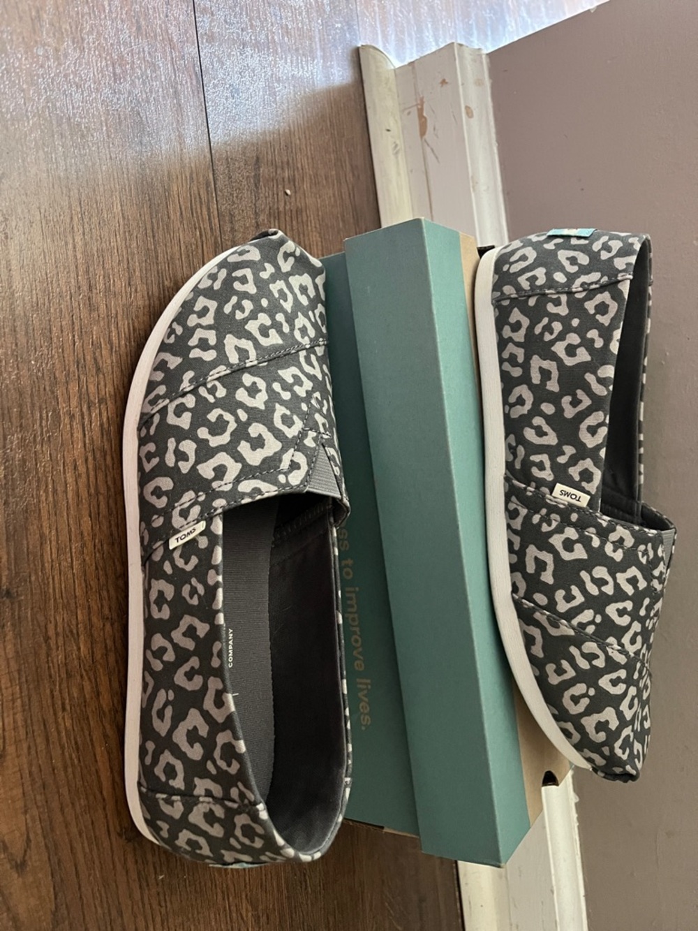 TOMS Women’s Black and White Leopard Print Slip-On Moccasins